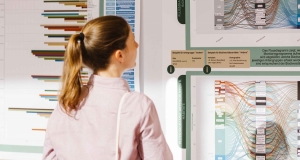 Eine Teilnehmerin der Fachtagung betrachtet ein Poster in der Posterausstellung zur Ist-Analyse der der Monitoringprogramme des bundesweiten Biodiversitätsmonitorings.