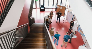 View from above on a group of people discussing in a World Café format.